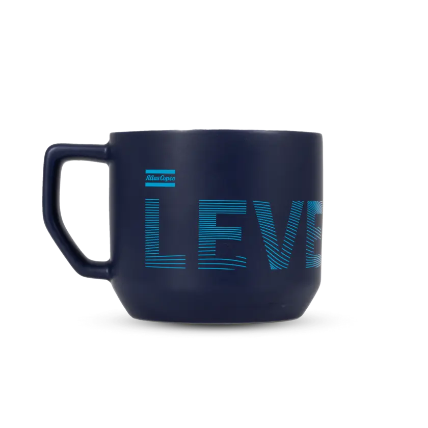 blue cheramic mug with atlas copco logo and text level up