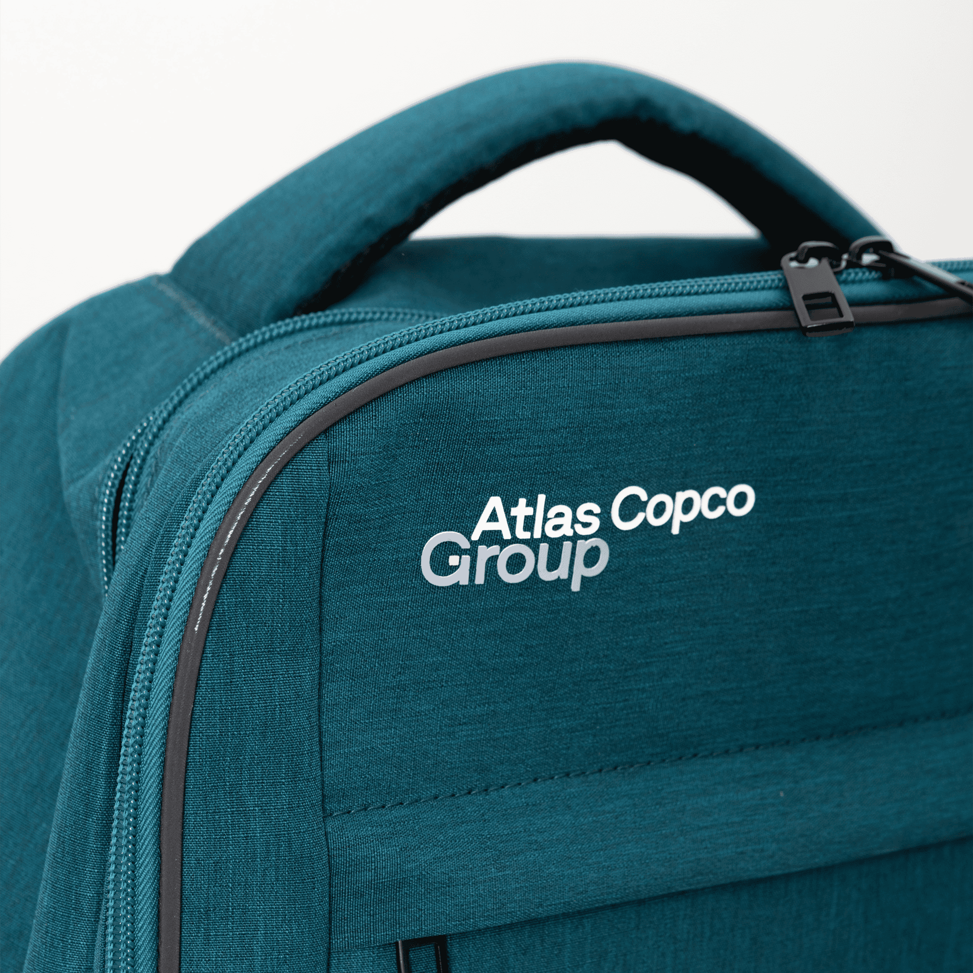 Teal color backpack with Atlas Copco Group logo