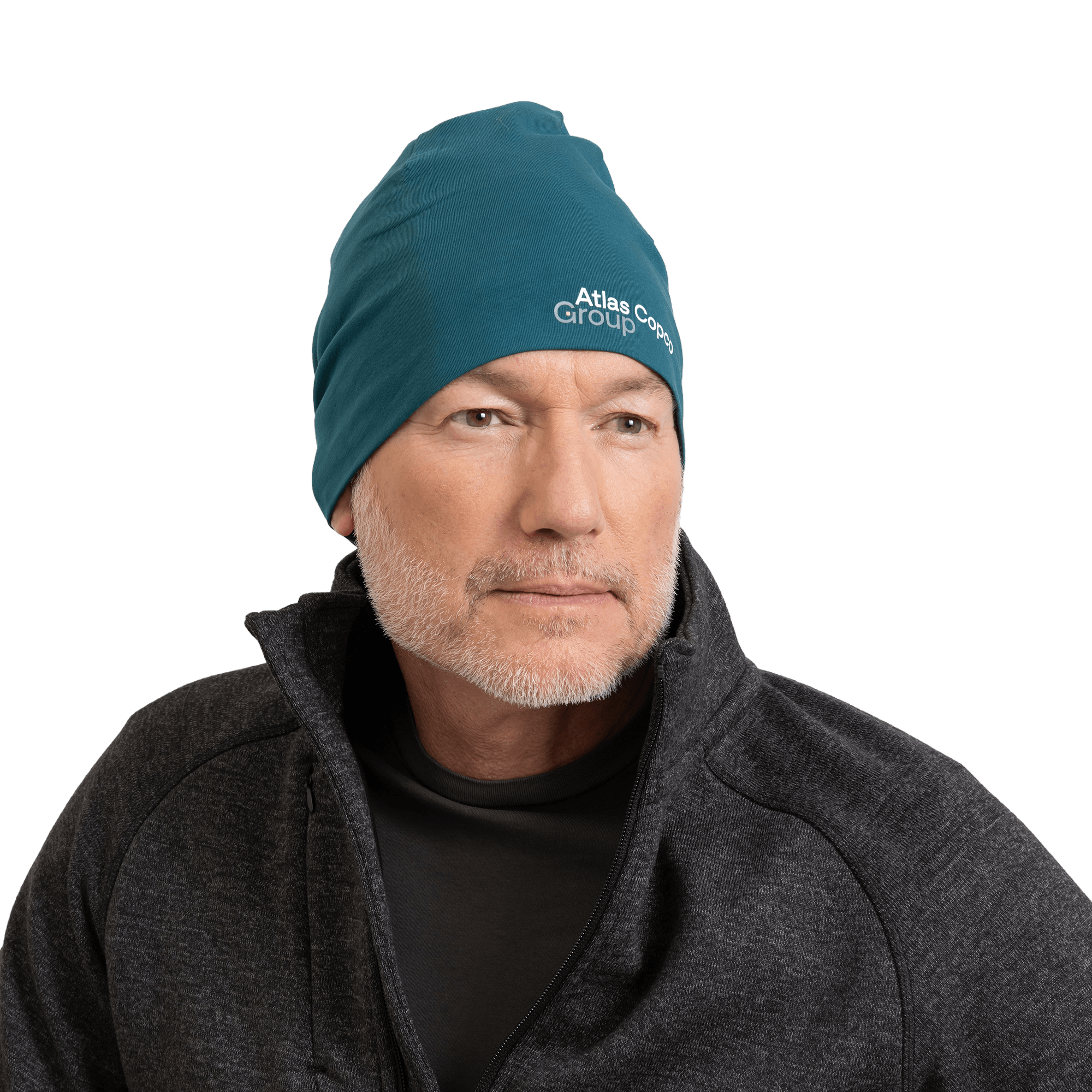 man wearing teal beanie with atlas copco group logo