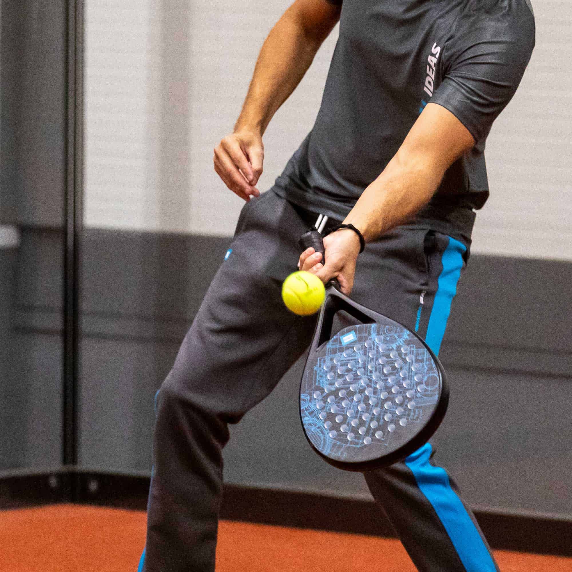 black padel racket with blueprint pattern